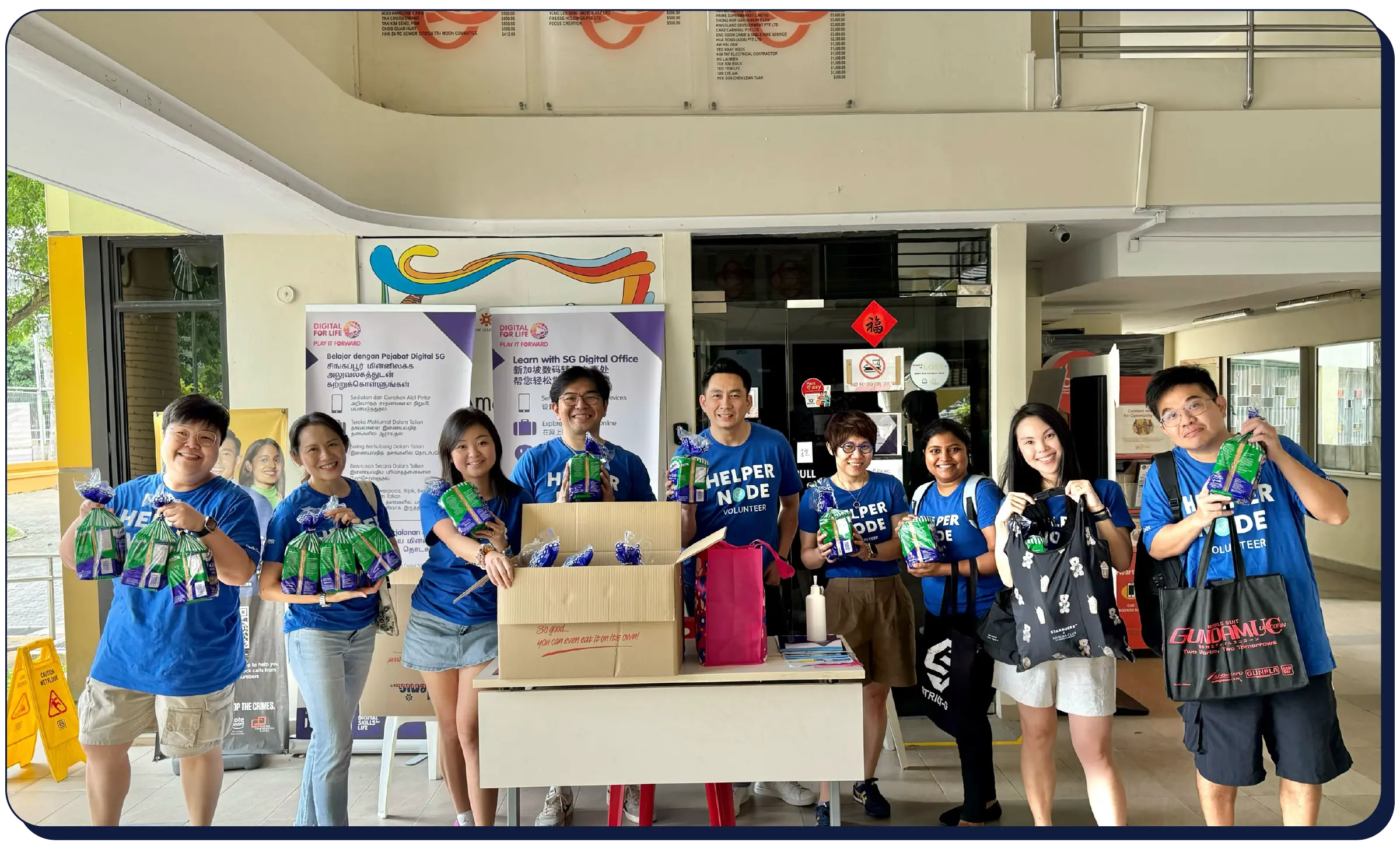 Smiling woman in an Elastic shirt sitting at a table