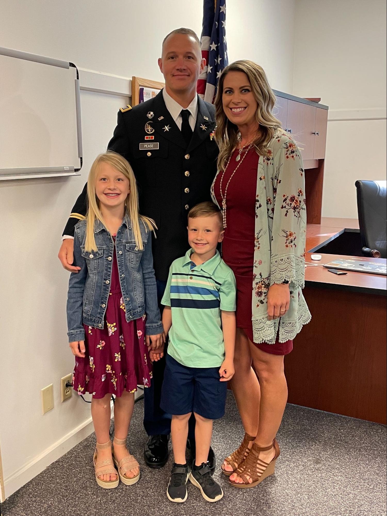 Stephanie and her family at her husband's promotion to Chief Warrant Officer 4