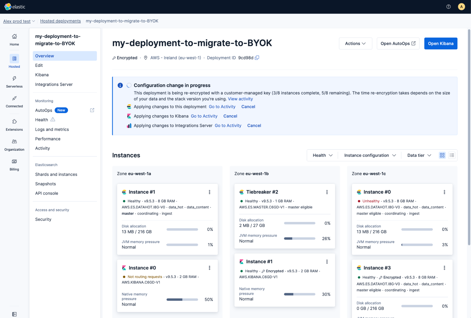 Overview page showing the "Configuration change in progress" banner with per-instance re-encryption progress