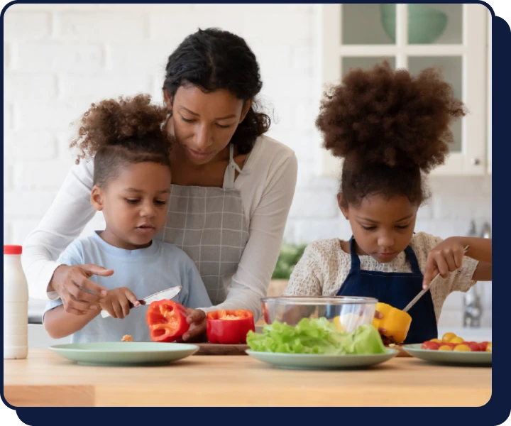 Smiling mother with work flexibility cooks with her child in kitchen