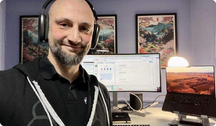 Sean Handley headshot with his desk in the background