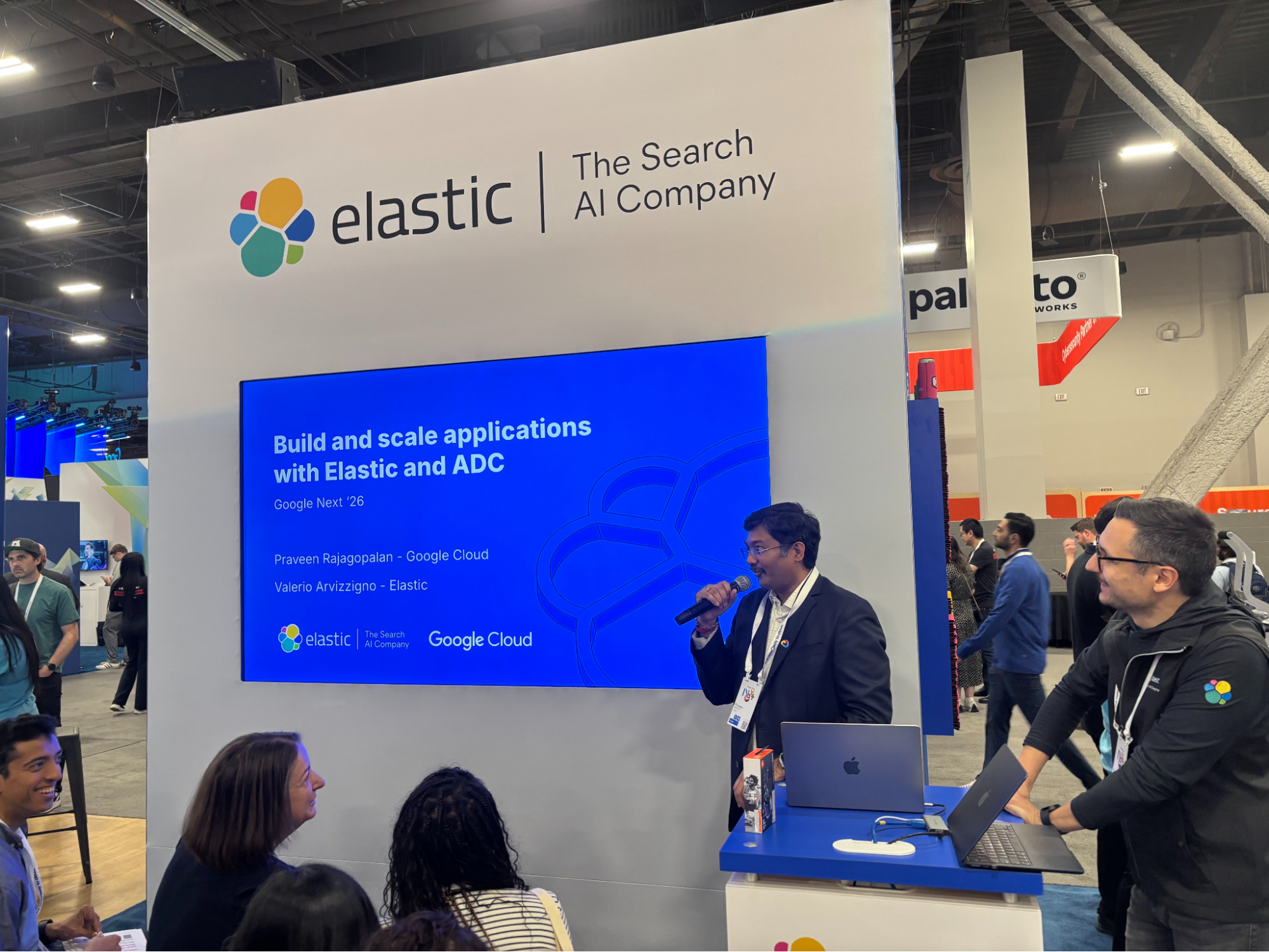 Elastic booth with a speaker talking about scaling apps with Elastic and Google Cloud ADC integration